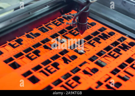 Perm, Russia - November 14, 2019: manufacturing plywood souvenirs on an automatic laser cutting machine Stock Photo