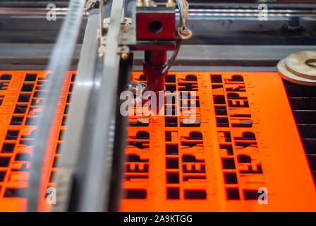 Perm, Russia - November 14, 2019: manufacturing plywood souvenirs on an automatic laser cutting machine Stock Photo