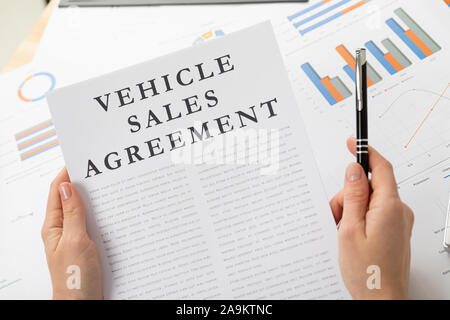 venicle sales agreement concept, documents on the desktop Stock Photo