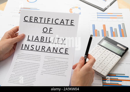 certificat of liability insurance concept, documents on the desktop Stock Photo