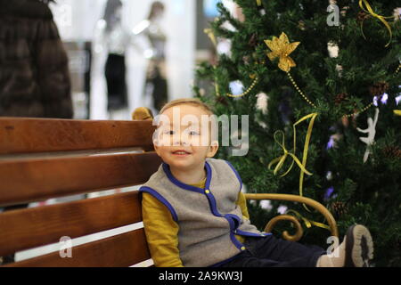 Child face christmas mood. Enthusiastic child. Good New Year spirit. Boy's face close up. Positive emotions. christmas mood. Stock Photo