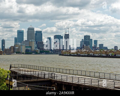 View on Canary Wharf skyline (left and centre) and Rotherhithe (right) from Free Trade Wharf over the jetty (Limehouse, London, UK) Stock Photo