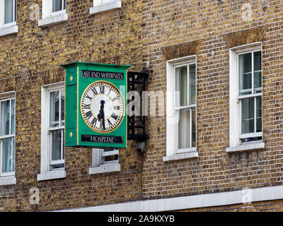 East End Maternity Hospital memorial clock next to Steel's Lane Health Centre on Commercial Road, Whitechapel, London, UK Stock Photo