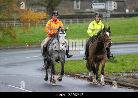 Horse riders in Chorley, Lancashire. UK Weather. 16th Nov, 2019. Cold, wet, blustry, cloudy day in rural Chorley. Rural community and countryside leisure users and the now-widespread view of high-visibility clothing as a road safety panacea. Stock Photo