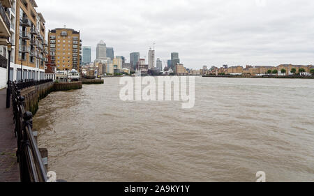View on Canary Wharf and Rotherhithe across Thames River from Thames Path near Narrow Street in Limehouse, London, UK Stock Photo