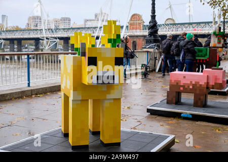 London, UK. 16th November 2019. In Celebration of Minecraft Earth Rollout,  one-of-a-kind, life-sized statues of interactive mobs popping up in London.  The statues are life-sized creations of the Muddy Pig, Moobloom and