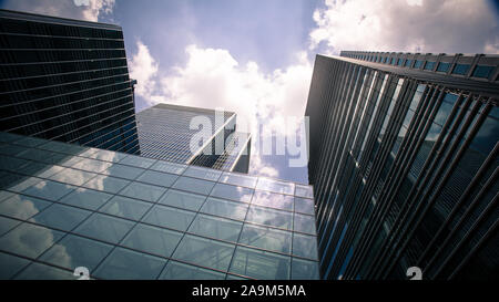 Docklands Skyscrapers. A low angle view of the glass and steel skyscrapers in London's Docklands district, a key UK financial and business district. Stock Photo