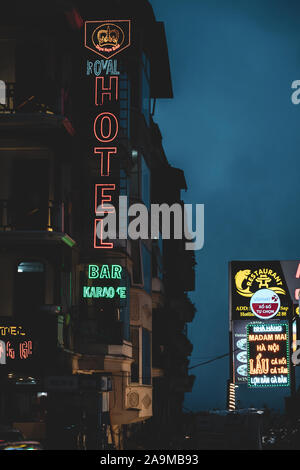 Sapa, Vietnam - 13th October 2019: Neon signs on hotels and restaurants in Sapa, the small little mountain town in Northern Vietnam Stock Photo