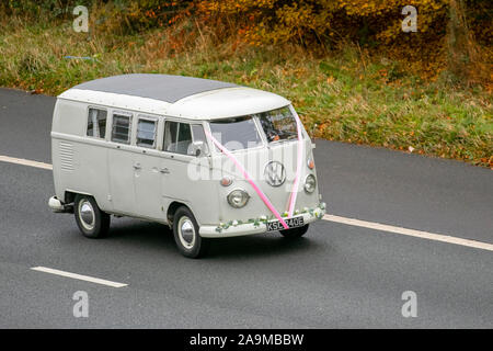 1967 60s Cream Vw split screen veteran Volkswagen; UK Vehicular traffic, old timers transport, old vehicles, classic saloon cars, south-bound on the 3 lane M61 motorway highway. Stock Photo