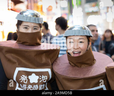 Tokyo, Japan - October 31st, 2018: Two women wearing halloween costumes in a street in Tokyo, Japan Stock Photo