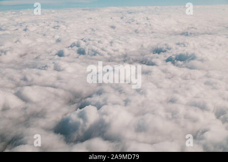 A lot of clouds seen from inside a plane Stock Photo
