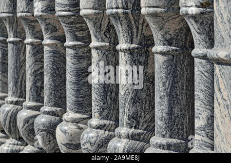 Beautiful gray marble balustrade illuminated by the bright sun. Stone background Stock Photo