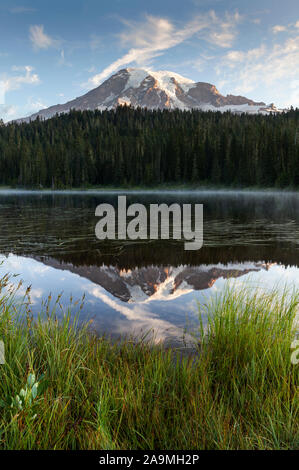WA17293-00...WASHINGTON - Sunrise at Reflection Lakes with Mount Rainier reflected in the calm waters, Mount Rainier National Park. Stock Photo