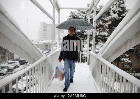 Tehran, Iran. 16th Nov, 2019. Iranians walk amid the snow in the capital Tehran. Heavy snowfall blanketed the streets of north Tehran on Saturday, causing traffic chaos and forcing the closure of schools, authorities in the Iranian capital said. Credit: Rouzbeh Fouladi/ZUMA Wire/Alamy Live News Stock Photo