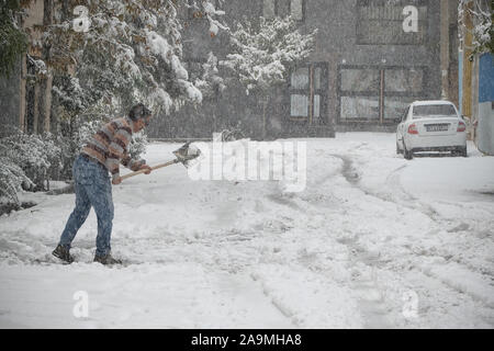 Tehran, Iran. 16th Nov, 2019. Iranian man shovels snow in the capital Tehran. Heavy snowfall blanketed the streets of north Tehran on Saturday, causing traffic chaos and forcing the closure of schools. Credit: Rouzbeh Fouladi/ZUMA Wire/Alamy Live News Stock Photo