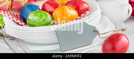 Easter Decoration Breakfast Table with red Easter Eggs and label as Background Stock Photo