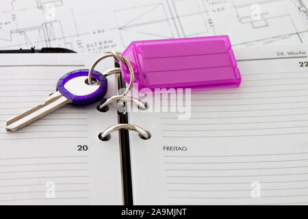 Calendar with key fob close-up as background Stock Photo