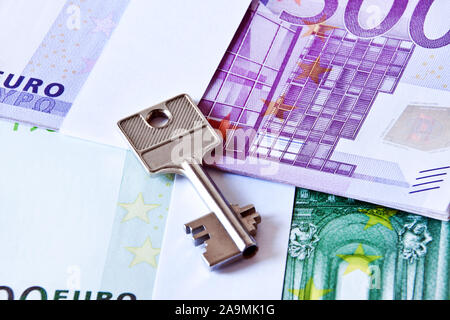 Euro cash with locker key as background Stock Photo