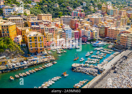 Aerial view of Camogli. Colorful buildings near the ligurian sea beach. View from above on boats and yachts moored in marina with green blue water. Stock Photo