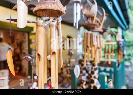 Hand made wind chimes hanging on a string with depth of field effect.  Ceramic wind chime hanging outside, selective focus, Wind bells from clay  Stock Photo - Alamy