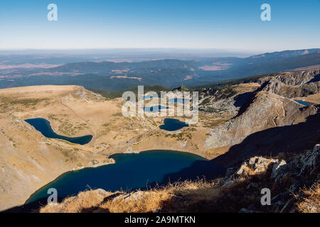 Mountain panorama with glacial blue lakes. Panoramic view of the Seven Rila Lakes, a famous natural landmark in the Rila Mountains, Bulgaria. Stock Photo