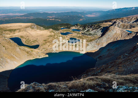 Mountain panorama with glacial blue lakes. Panoramic view of the Seven Rila Lakes, a famous natural landmark in the Rila Mountains, Bulgaria. Stock Photo