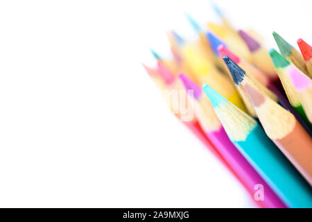 bright vibrant colored pencils in line on white background Stock Photo