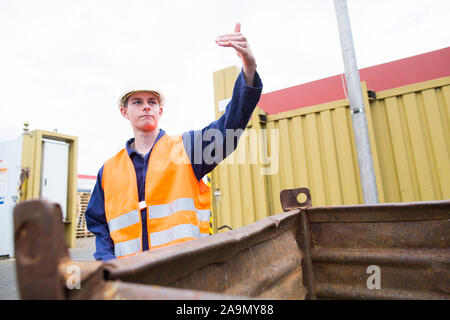 worker young male waving Stock Photo