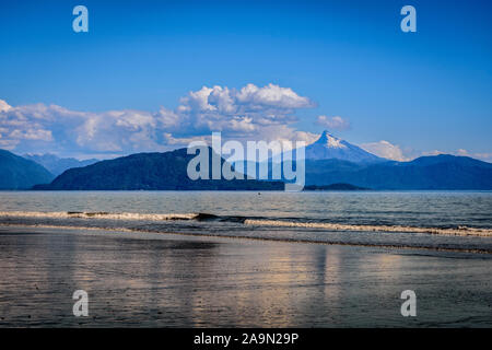 Landscape view of Corcovado volcano seen from Santa Barbara beach in Chaitén, Patagonia, Chile Stock Photo