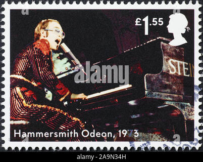 Elton John in concert at on postage stamp Stock Photo