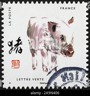 Painting of the pig of chinese zodiac on postage stamp Stock Photo
