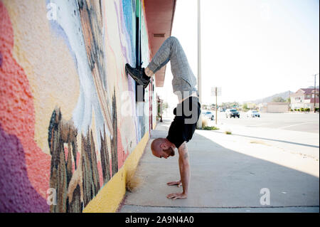Middle aged man with a beard practicing yoga. Stock Photo