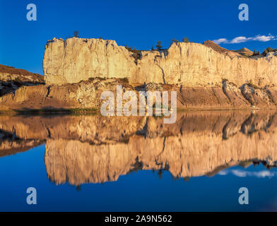 white cliffs reflected in the missouri river near virgelle, montana Stock Photo