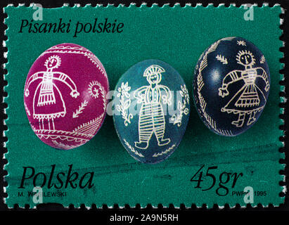Three painted eggs for Easter on polish postage stamp Stock Photo