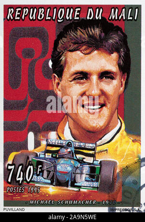 Racing driver Michael Schumacher on postage stamp Stock Photo