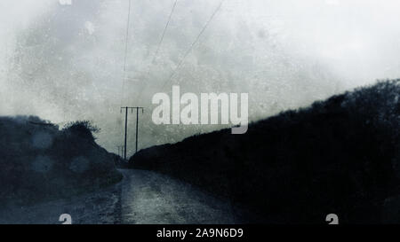 An eerie, atmospheric country lane with telegraph poles leading into the distance. With a grunge, out of focus, blurred, weathered, textured, edit. On Stock Photo