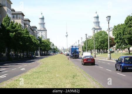 Berlin, Germany - May 09, 2016: Road traffic along the Karl-Marx-Allee with the towers of the Frankfurter Tor in the district Friedrichshain on May 09 Stock Photo