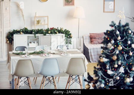 Background image of elegant dining room decorated for Christmas party in subtle gold and silver tones, copy space Stock Photo