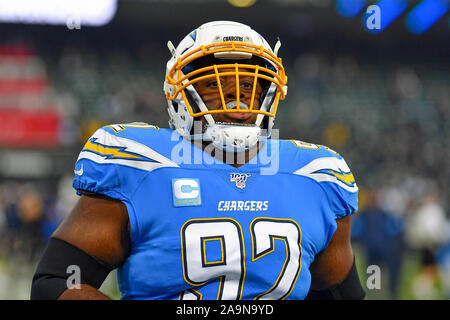 Los Angeles Chargers defensive tackle Sebastian Joseph-Day (69) and  linebacker Troy Reeder (42) tackle Seattle Seahawks quarterback Sean  Mannion (9) in the end zone for a safety during the second half of