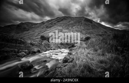 Long exposure shoot of mountain creek at scenic valley in autumn. Lake District National Park in United Kingdom - Monochrome Edit