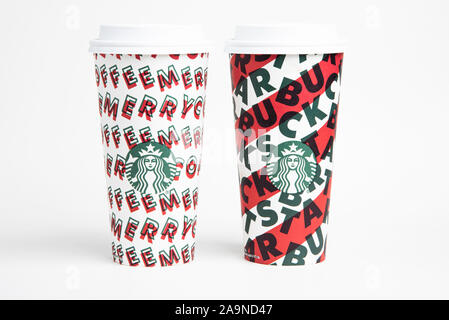 Two designs of Starbucks’ 2019 holiday theme hot beverage disposable carry cups. Stock Photo