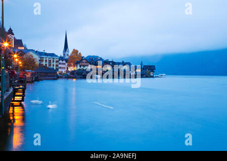 Hallstatt town view in a foggy day and clouds between the mountains, Austria. Stock Photo