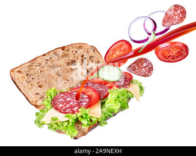 sandwich with falling in bread salami and splashing ketchup. Fast food with flying ingredients isolated on white background Stock Photo