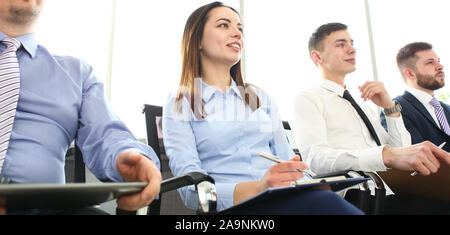 Group of people sitting in queue in office listening some important information Stock Photo