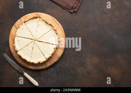 Classic Cheesecake. Cheesecake New York on dark background, top view, copy space.