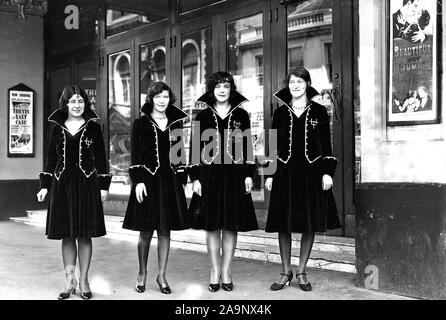 Usherettes standing in the doorway of the New Strand Theatre, Liverpool Street, Hobart (1930) - Mandatory Photo Credit: TAHO Stock Photo