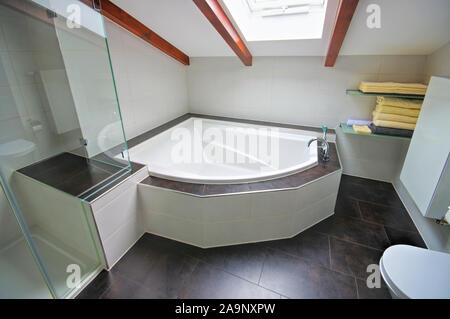 a modern bright tiled bathroom Stock Photo