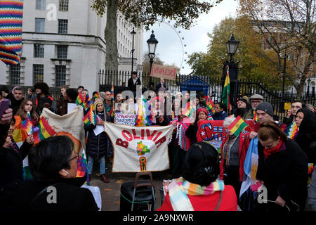 London, UK. 16th Nov, 2019. Supporters of President Evo Morales demand a resignation of a self-proclaimed interim president Janine Añez during the demonstration.People gathered outside Downing Street to raise their voices against the coup in Bolivia and show their support to President Evo Morales. Morales won the past elections for his fourth consecutive period as a president, but the opposition claimed that there was a fraud. Morales has to quit power while in exile after the Army chief suggested to Morales to abandon the presidency. Credit: SOPA Images Limited/Alamy Live News Stock Photo