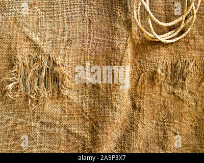 Hemp sack and rope on wall Stock Photo