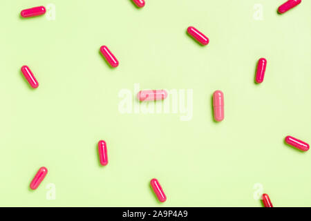 Colorful medicine pills capsules on a single color background Stock Photo
